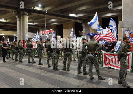 Anti-government protestors hold Israeli flags and chant 'Until he goes away' during a demonstration against the government's planned judicial overhaul at Ben Gurion airport near Tel Aviv, where Netanyahu will be departing for the US on a state visit on September 17, 2023 in Lod, Israel. Netanyahu's government has been advancing controversial legislation to overhaul the country's Supreme Court, sparking a wave of demonstrations