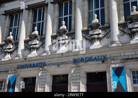 Bordeaux , France - 09 12 2023 : Bordeaux universite University entrance facade historical building ancient with blue logo brand and sign text flag in Stock Photo