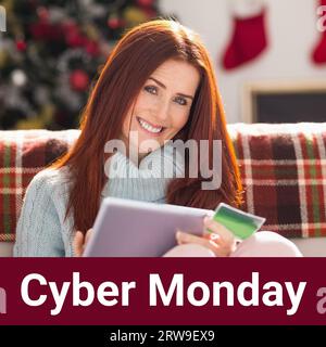 Cyber monday text over happy caucasian woman on couch using tablet and credit card shopping online Stock Photo