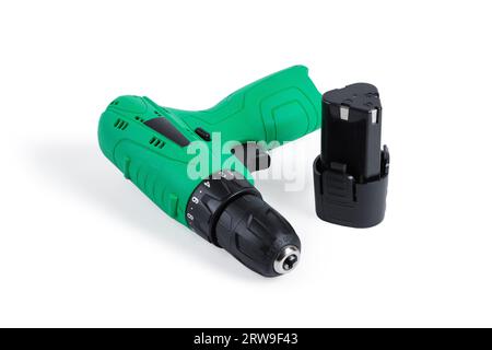 Green cordless screwdriver. Close-up. Isolated on white background. Stock Photo