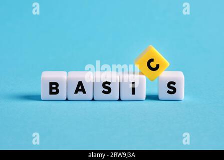 Back to basics. Simplifying business procedures. Essential or primary concepts and basis of education. Teaching the basics. The word basics on cubes. Stock Photo