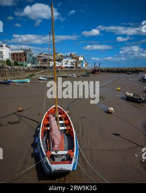 A vertical shot of a  Boat beached during low tide in Bridlington harbor. Stock Photo