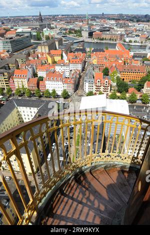Climbing up / down the external spiral winding staircase at the Church of Our Saviour in Copenhagen,  Denmark. Stock Photo