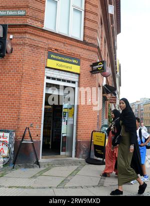 Muslim women walking on Nørrebrogade, Copenhagen, Denmark. Stock Photo