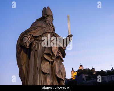 Sculpture Saint Burkardus holding a sword, first bishop of Wuerzburg, Burkard, Burkhard, behind Marienberg Fortress, Old Main Bridge, Wuerzburg Stock Photo