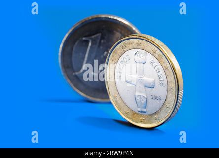 Euro coins from Cyprus on blue background Stock Photo - Alamy