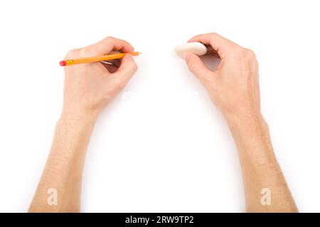 Left-handed person with pencil and eraser Stock Photo