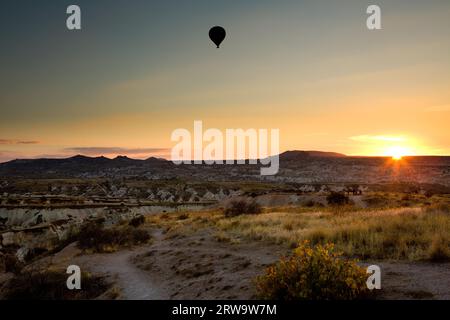 Balloon at sunset flying above Cappadocia, Turkey Stock Photo