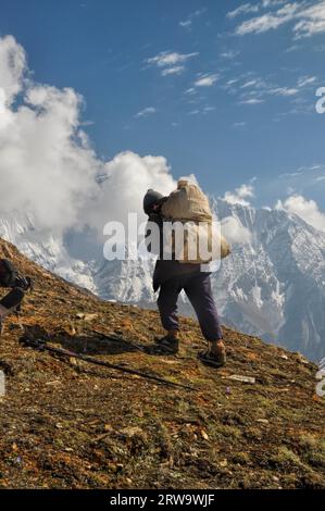 Sherpa in picturesque Himalayas mountains in Nepal Stock Photo