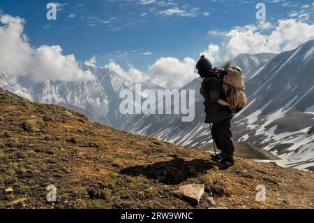 Sherpa in picturesque Himalayas mountains in Nepal Stock Photo