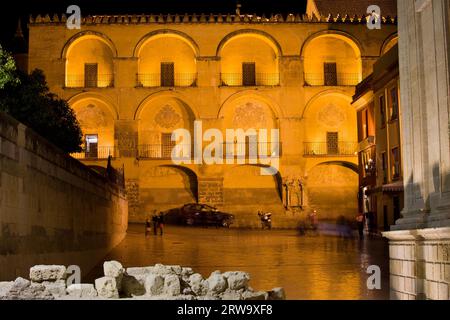 The Mezquita (The Great Mosque) historic facade illuminated at night, Plaza del Triunfo, Cordoba, Spain Stock Photo