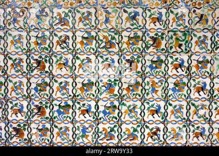 Historic tiled wall with many mythical creatures: satyrs, centaurs, unicorns in Real Alcazar, Seville, Spain, Andalusia region Stock Photo