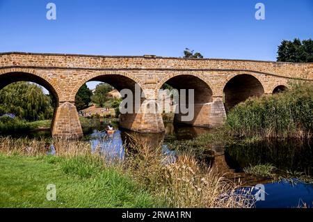 The iconic Richmond Bridge on bright sunny day. Richmond, Tasmania, Australia. Australia's oldest bridge made of stone was built in 1823 Stock Photo