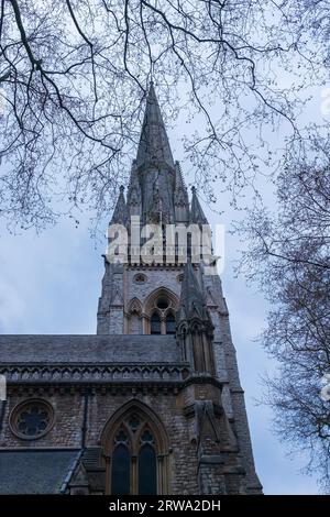 London, UK, 2023. The neogothic church of St Mary Abbots (designed in 1872) on Kensington High Street has the tallest spire in London Stock Photo