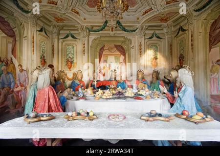 Jesus at the Last Supper with the twelve apostles. Depicted in terracotta figures with real hair and frescoes by Antonio Orgiazzi the Elder in 1779. Stock Photo