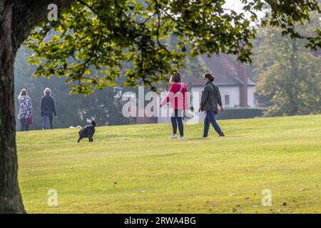 UK, Weather, Northampton,18th September 2023. Over night rain clearing for dog walkers exercising their pets early morning in Abington Park  with  patches of sunshine showing occasionally with more rain forecast for later today. Credit: Keith J Smith/Alamy Live News Stock Photo