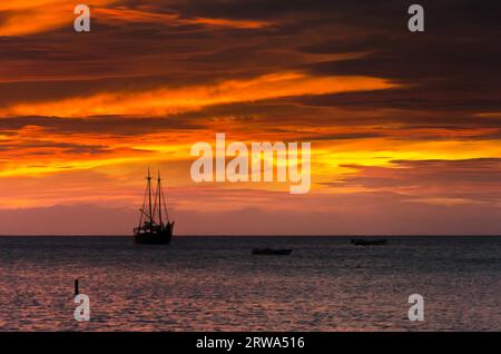 the Golden hour with sail boats on sea anchored Stock Photo - Alamy