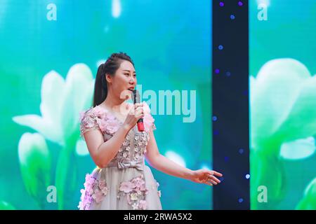 Luannan County, China - August 15, 2019: Female singing on stage, Luannan County, Hebei Province, China Stock Photo