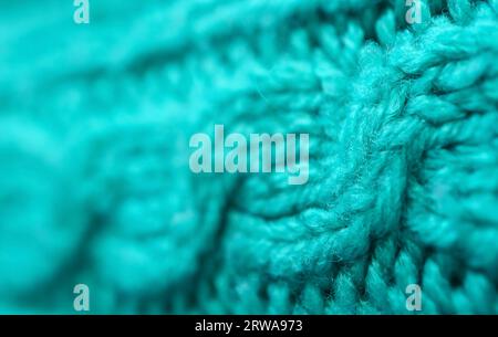 Closeup of the Pattern and Texture of Turquoise Blue Knitted Wool Fabric Stock Photo