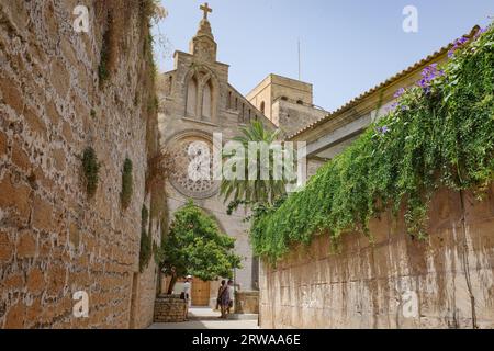 Alcudia, Spain - 9 July, 2023: Sant Jaume Church and castle walls, Alcudia, Mallorca Stock Photo