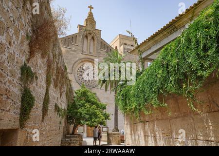 Alcudia, Spain - 9 July, 2023: Sant Jaume Church and castle walls, Alcudia, Mallorca Stock Photo