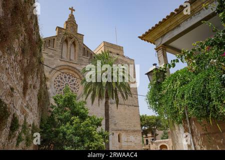 Alcudia, Spain - 9 July, 2023: Sant Jaume Church and castle walls, Alcudia, Mallorca Stock Photo