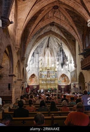 Alcudia, Spain - 9 July, 2023: Sunday service at the Sant Jaume Church in old town Alcudia, Mallorca Stock Photo