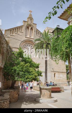 Alcudia, Spain - 9 July, 2023: Sant Jaume Church and castle walls, Alcudia, Mallorca Stock Photo