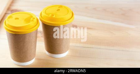 Two Disposable Coffee Cups on table top with copy space. Stock Photo