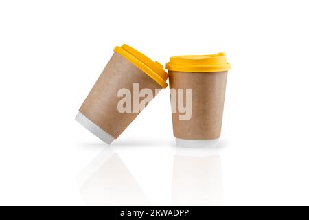 Isolated mockup template of two paper takeaway coffee cups on a white reflective surface. Stock Photo