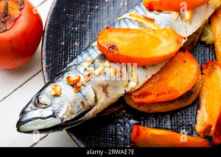 Fish cooked in persimmon fruit marinade Stock Photo