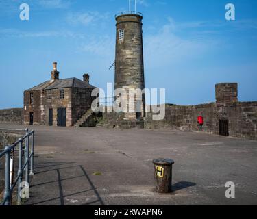 The historic 18th century watch tower and pier masters watch house on the Old Quay at Whitehaven, West Cumbria, UK Stock Photo