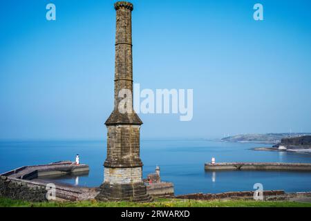 The ornate 'Candlestick' ventilation chimney standing proud above Whitehaven's historic outer harbour, West Cumbria, UK Stock Photo