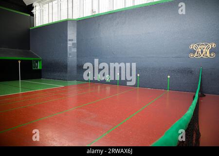 Interior / inside the Royal Tennis Court, Hampton Court Palace, a Grade I listed court for playing the sport of real tennis. (135) Stock Photo