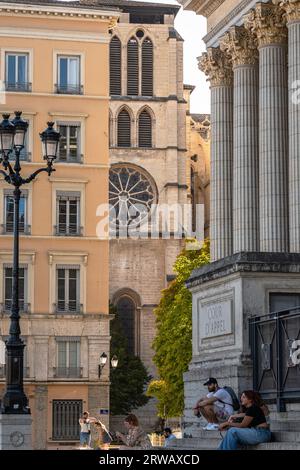 Tourists rest on the steps of the Court of appeal in Lyon Old Town, France. Stock Photo