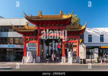 Adelaide, Australia - December 19, 2020: Adelaide Chinatown arch with people in city centre viewed towards main entrance through Paifang on Gouger Str Stock Photo