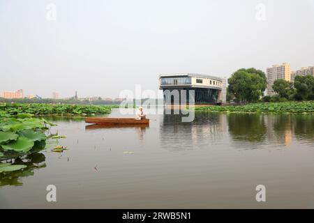 Luannan County, China - July 15, 2019: Fishing boats swimming in the pond, Luannan County, Hebei Province, China Stock Photo