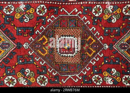 Detail from a traditional Turkish carpet. Hand-woven carpets belong to the late 20th century. Stock Photo