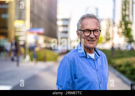 Portrait of mature man standing in the city Stock Photo