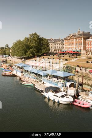 Peggy Jean Barge and exclusive riverside property on the River Thames at Richmond Upon Thames, London, England, U.K. Stock Photo