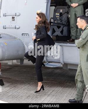 The Princess of Wales jumps out of a Royal Navy Merlin Mk2 helicopter during a visit to the Royal Naval Air Station (RNAS) Yeovilton, near Yeovil in Somerset, one of the Royal Navy's two principal air stations and one of the busiest military airfields in the UK. Picture date: Monday September 18, 2023. Stock Photo