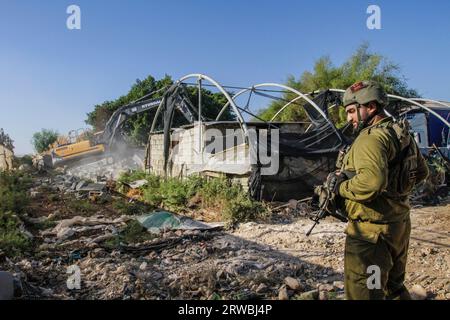 Jordan Valley, Palestine. 18th Sep, 2023. Israeli army bulldozer on duty during the demolition of Palestinian homes in the northern Jordan Valley in the occupied West Bank. Israeli army bulldozer demolished Palestinian homes to deport them from the area because the area is a border between the lands inhabited by Palestinians and the lands seized by the Israeli authorities. (Photo by Nasser Ishtayeh/SOPA Images/Sipa USA) Credit: Sipa USA/Alamy Live News Stock Photo