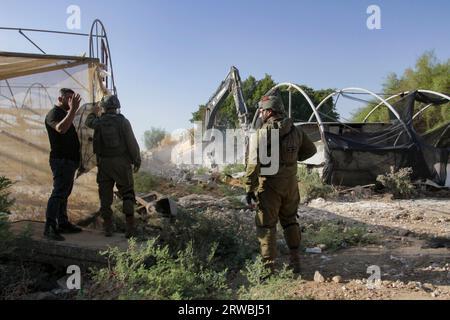 Jordan Valley, Palestine. 18th Sep, 2023. Israeli army bulldozer on duty during the demolition of Palestinian homes in the northern Jordan Valley in the occupied West Bank. Israeli army bulldozer demolished Palestinian homes to deport them from the area because the area is a border between the lands inhabited by Palestinians and the lands seized by the Israeli authorities. (Photo by Nasser Ishtayeh/SOPA Images/Sipa USA) Credit: Sipa USA/Alamy Live News Stock Photo