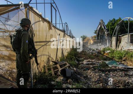 Jordan Valley, Palestine. 18th Sep, 2023. Israeli army bulldozer on duty during the demolition of Palestinian homes in the northern Jordan Valley in the occupied West Bank. Israeli army bulldozer demolished Palestinian homes to deport them from the area because the area is a border between the lands inhabited by Palestinians and the lands seized by the Israeli authorities. (Photo by Nasser Ishtayeh/SOPA Images/Sipa USA) Credit: Sipa USA/Alamy Live News Stock Photo