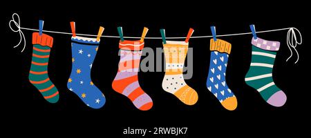 Set of colorful children socks with patterns on a rope with colored clothespins. Vector illustration. Stock Vector