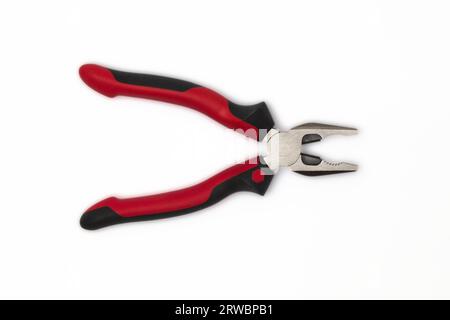 Wire pliers, also known as combination pliers or lineman's pliers, are versatile hand tools designed for gripping, bending, twisting, and cutting wire Stock Photo