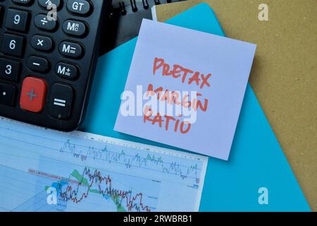 Concept of Pretax Margin Ratio write on sticky notes isolated on Wooden Table. Stock Photo