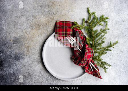 Place setting for Christmas or New Year Eve festive dinner on stone background Stock Photo