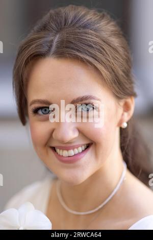 Bride holding elegant white orchid bouquet Stock Photo - Alamy