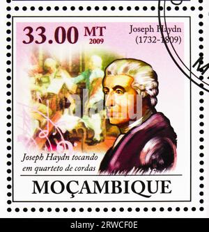 MOSCOW, RUSSIA - JULY 12, 2022: Postage stamp printed in Mozambique shows Playing in String Quartet, Joseph Haydn, 200th Death Anniversary (2009) seri Stock Photo